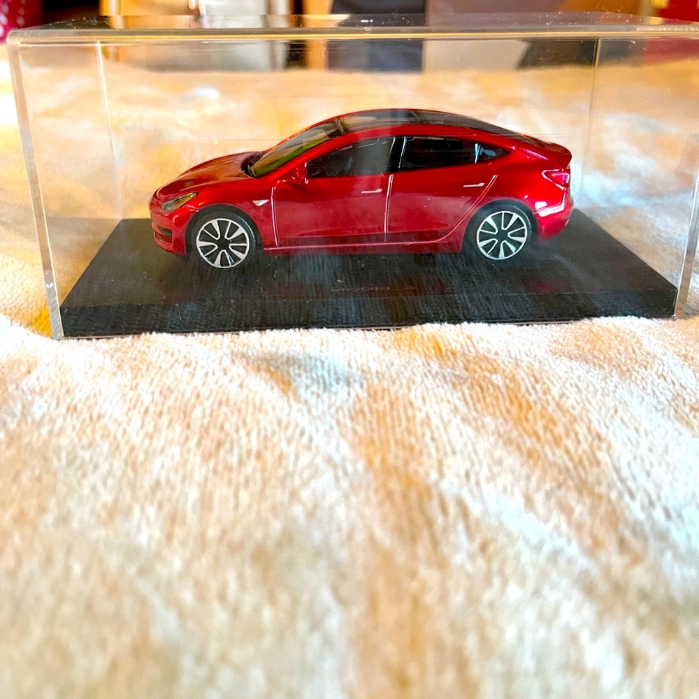 Tesla Model 3 car in plastic box